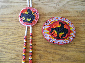 End of the Trail image Bolo tie (Nez Perce) and belt buckle (Shoshone/Bannock)